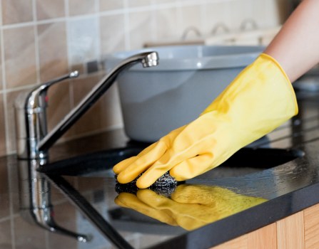 Professional cleaning focus for a rental kitchen and bathroom