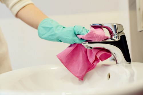 Professional upholstery cleaning on a sofa in a living room