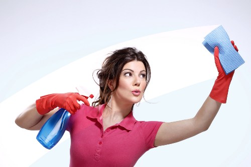 Turnover cleaning for a short-term rental bedroom with fresh linens